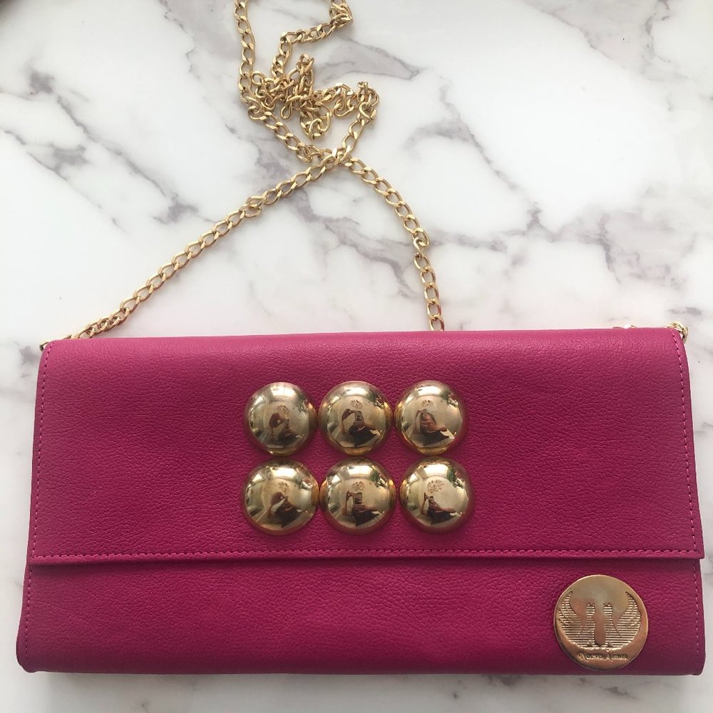 Pink clutch with gold accents